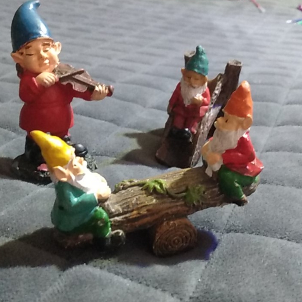 Set of tiny garden gnome statues